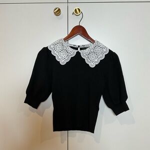 Elegant Black Top with White Lace Collar